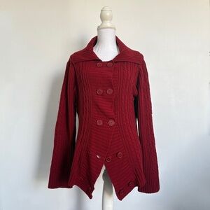 Red cable knit button up sweater.